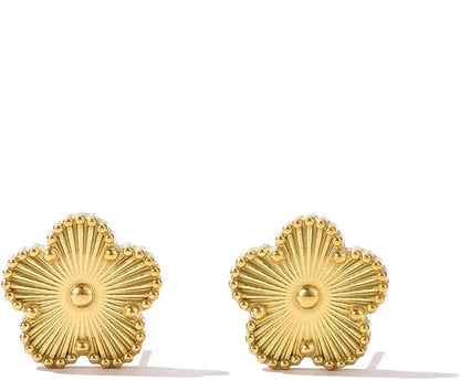 Pair of  gold clover earrings on a white background