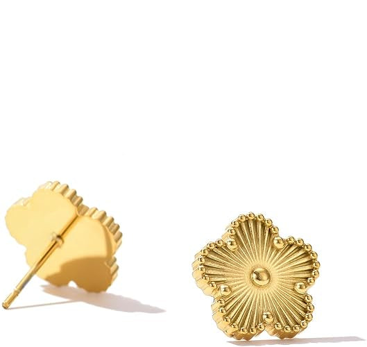 Pair of gold earrings on a white background