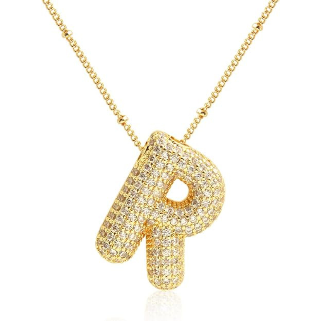 Gold necklace with a letter 'R' pendant on a white background