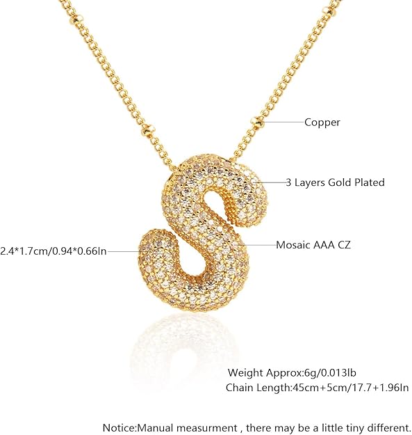 Gold necklace with a letter 'S' pendant on a white background