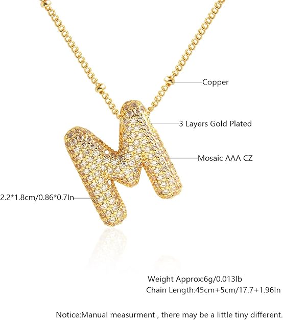 Gold necklace with letter 'M' pendant, showing material details and measurements.