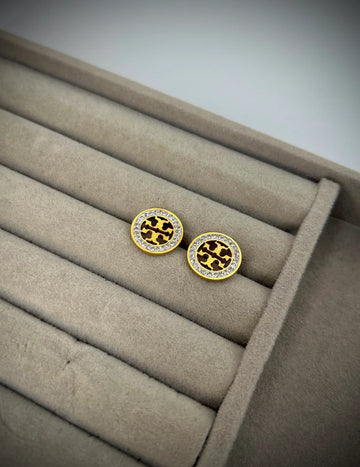 Gold earrings with Tory Burch Design